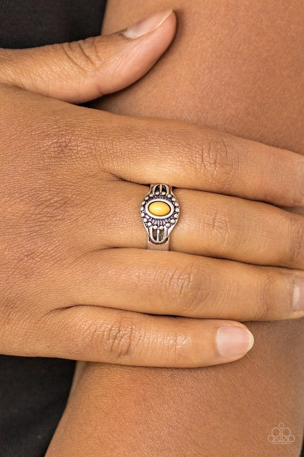 Paparazzi Accessories Right on TREK - Yellow An earthy yellow bead is pressed into the center of a dainty silver band radiating with tribal inspired textures for a seasonal look. Features a dainty stretchy band for a flexible fit. Sold as one individual r