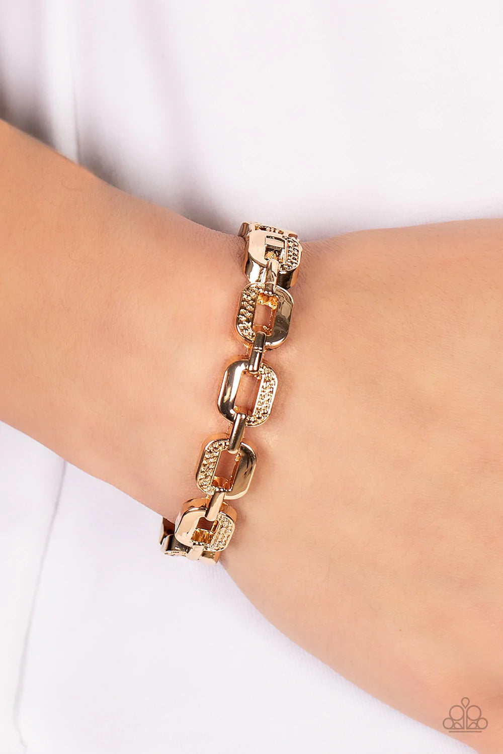 Paparazzi Accessories Powerhouse Plunder - Gold Alternating in sections of dotted texture, an oversized collection of gold chain links interlock into a solid bangle-like bracelet around the wrist. Features a hinged closure. Sold as one individual bracelet