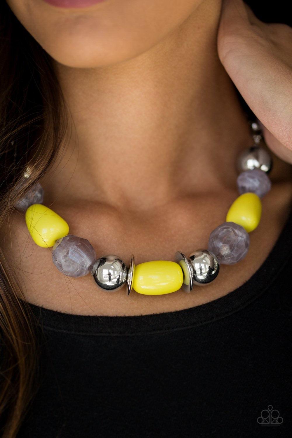 Paparazzi Accessories South Shore Sensation - Yellow Dramatic silver, sunny yellow, and faceted cloudy beads are threaded along an invisible wire below the collar for a seasonal look. Features an adjustable clasp closure. Jewelry