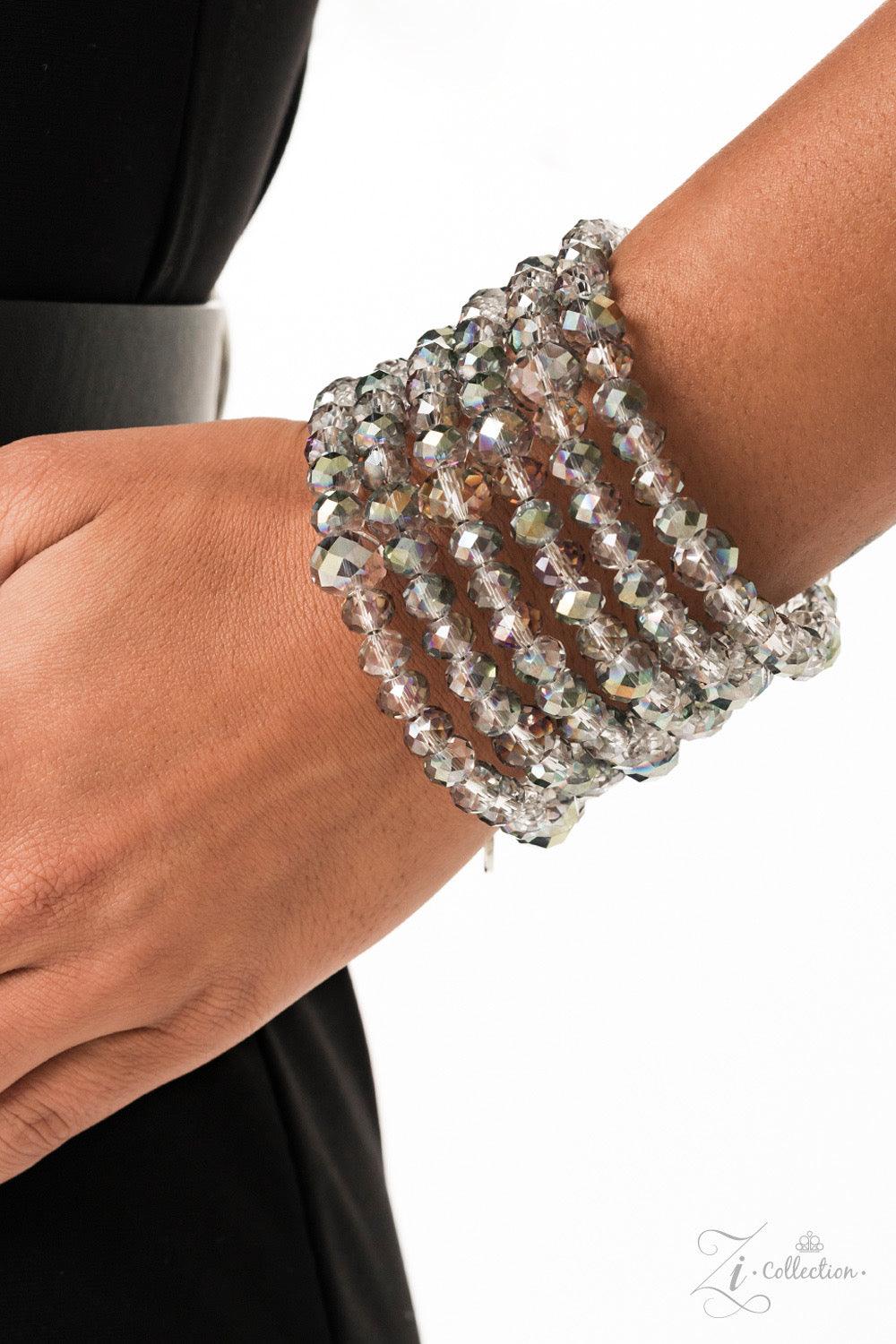 Paparazzi Accessories Inner Radiance Countless clear, crystal-like beads are threaded along a coiled wire, creating an infinity wrap bracelet. Each faceted edge of the beads is brushed in a dreamily iridescent or hypnotic oil spill finish that flickers an