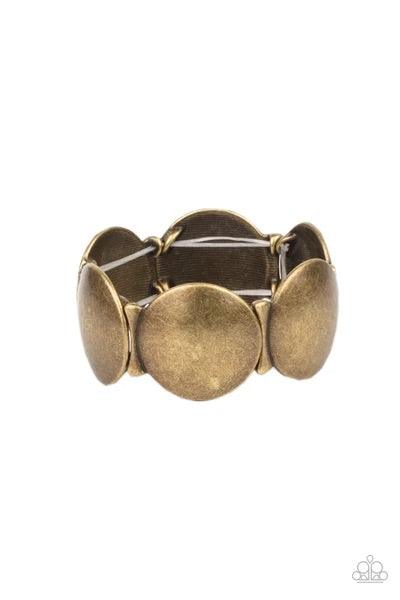 Paparazzi Accessories Going, Going, GONG! - Brass Infused with curved bar-like accents, an antiqued series of beveled brass discs are threaded along stretchy bands around the wrist for a bubbly metallic look. Sold as one individual bracelet. Jewelry