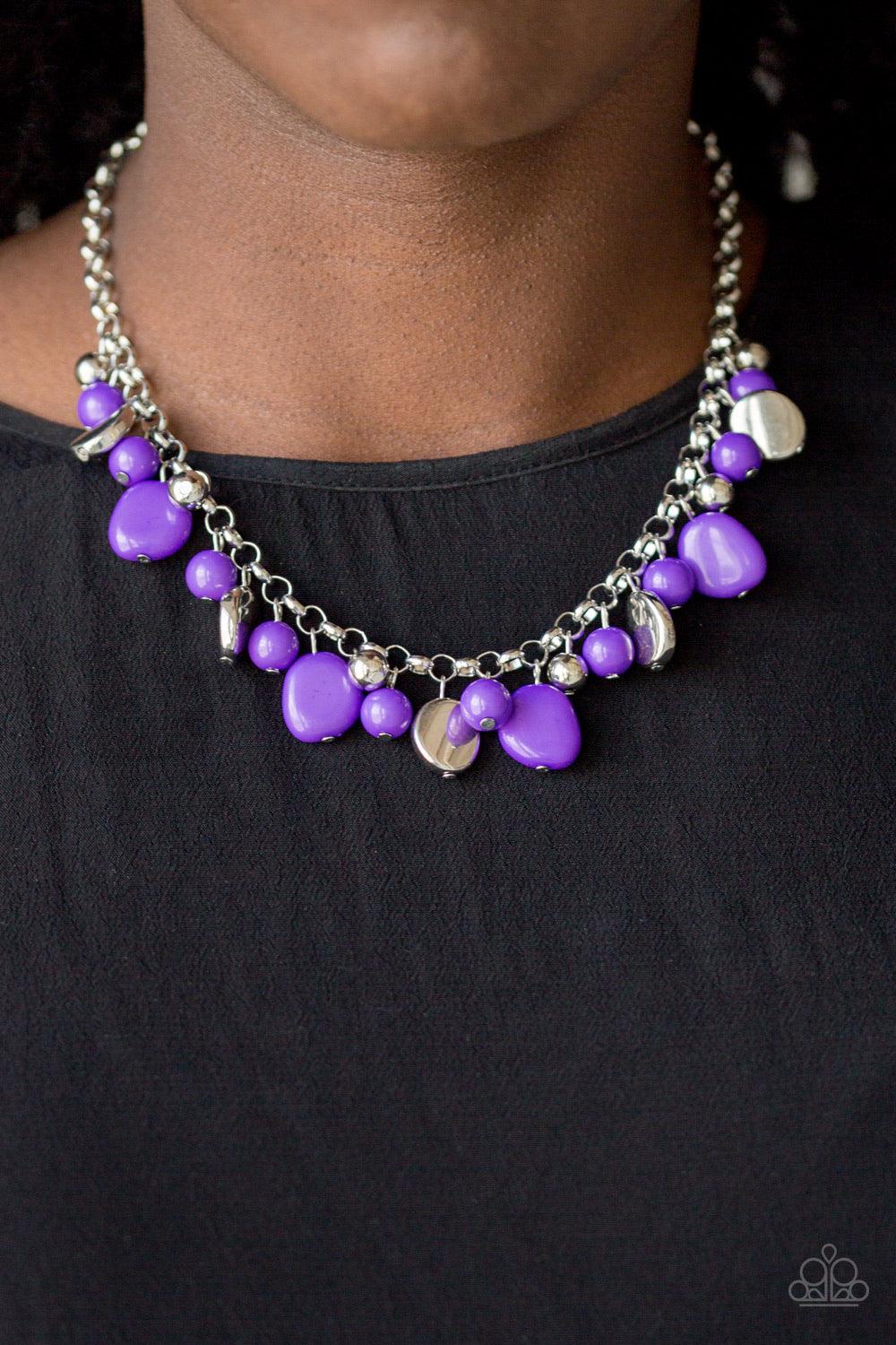 Paparazzi Accessories Flirtatiously Florida - Purple Featuring round and asymmetrical shapes, shiny silver and purple beads swing from the bottom of a bold silver chain, creating a flirtatious fringe below the collar. Features an adjustable clasp closure.