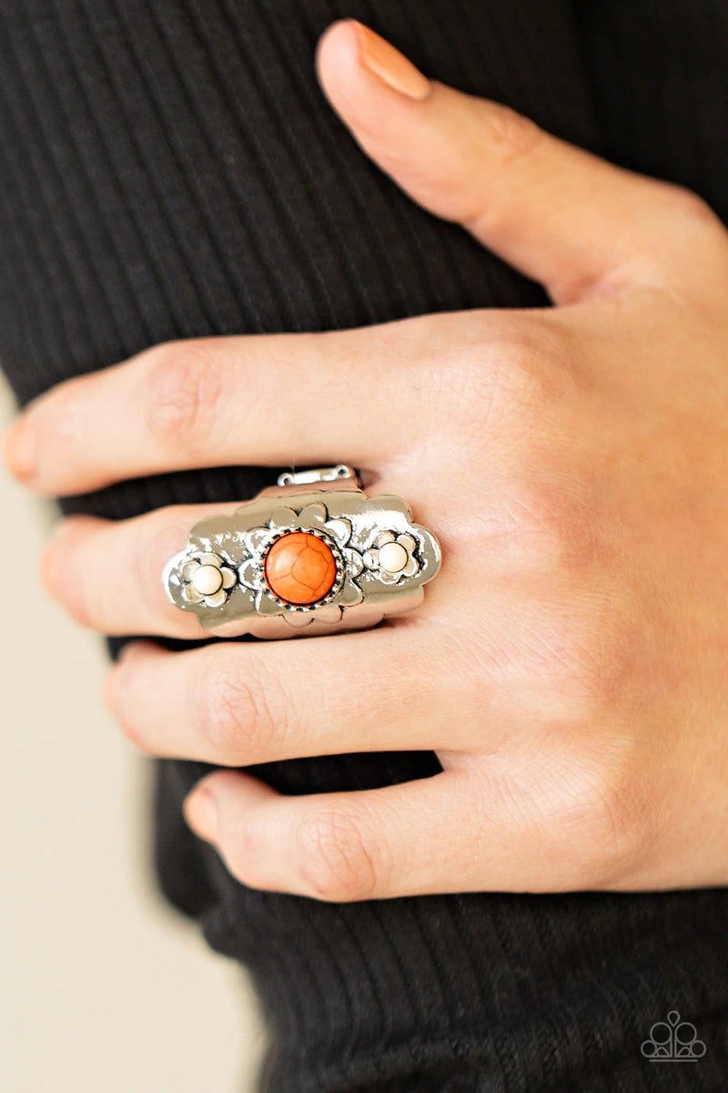 Paparazzi Accessories Badlands Garden - Orange Featuring orange and white stone centers, shiny silver flowers bloom atop a scalloped silver frame for a whimsically seasonal look atop the finger. Features a stretchy band for a flexible fit. Sold as one ind