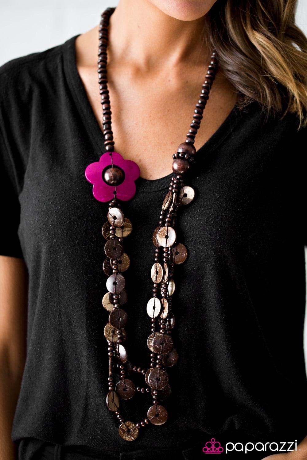 Paparazzi Accessories Honolulu Hula - Pink Shiny wooden beads trickle along a brown thread, creating an earthy chain. Tinted in a vibrant pink finish, a wooden floral accent gives way to dramatic layers of wooden beads and wooden discs for a summery finis