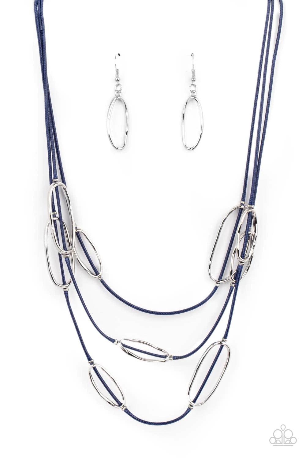 Paparazzi Accessories Check Your CORD-inates - Blue An asymmetrical collection of hammered silver ovals are fitted in place along three rows of shiny blue cords, creating an edgy display below the collar. Features an adjustable clasp closure. Sold as one