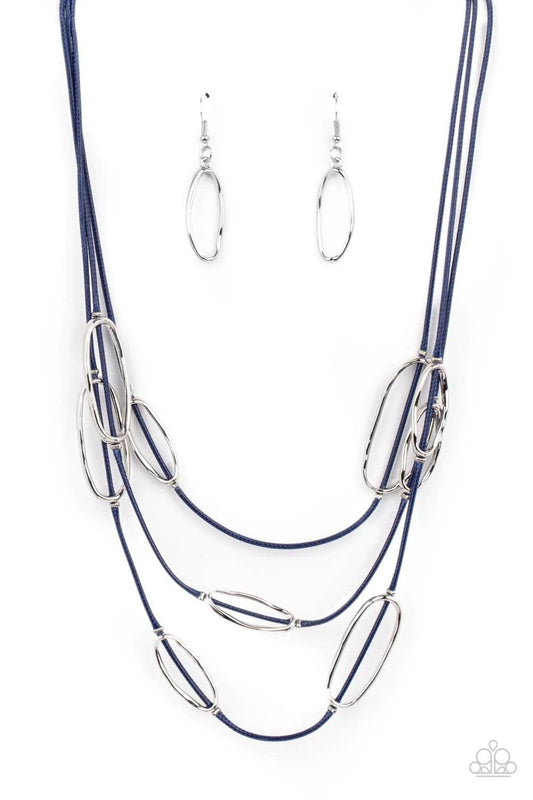 Paparazzi Accessories Check Your CORD-inates - Blue An asymmetrical collection of hammered silver ovals are fitted in place along three rows of shiny blue cords, creating an edgy display below the collar. Features an adjustable clasp closure. Sold as one