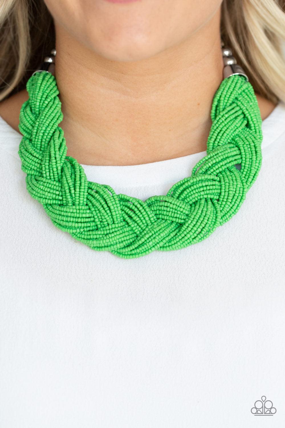 Paparazzi Accessories The Great Outback - Green Brushed in an energetic green hue, countless seed beads weave into an indigenous braid below the collar. The colorful strands attach to large silver beads, adding a hint of metallic shimmer to the playful de