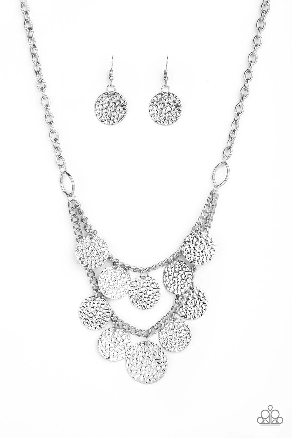 Paparazzi Accessories Chime Warp - Silver Rippling with glistening textures, glistening silver discs dance along two shimmery silver chains, creating an edgy fringe below the collar. Features an adjustable clasp closure. Sold as one individual necklace. I