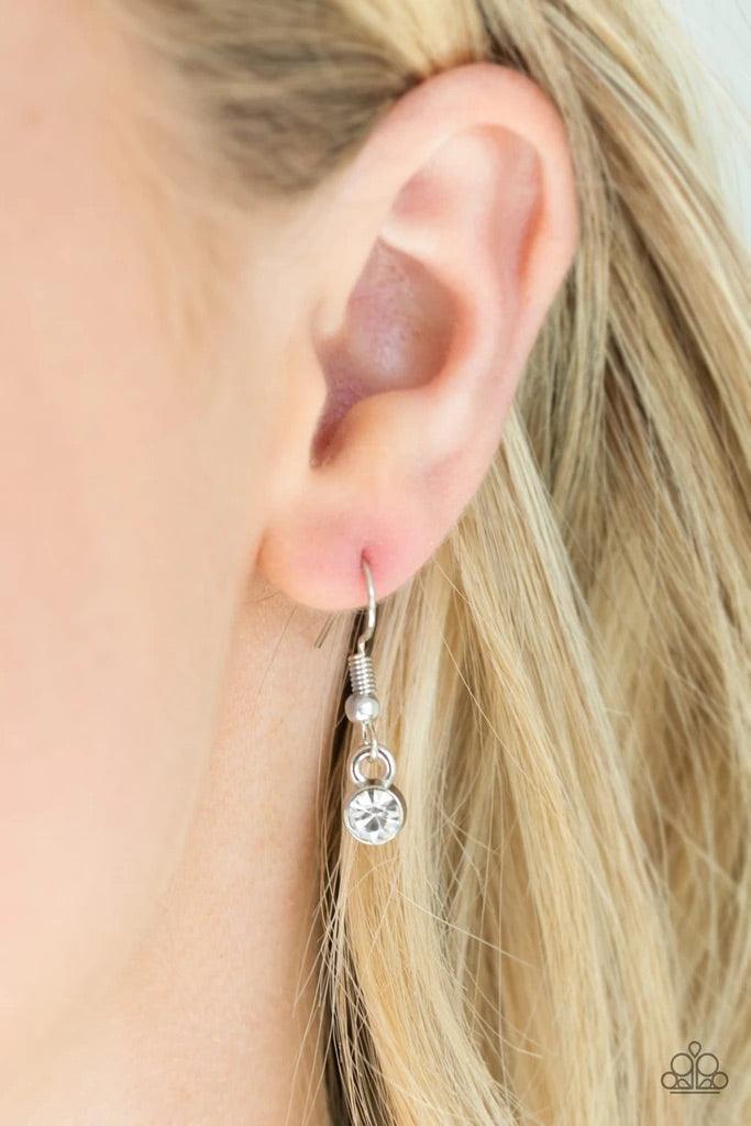 Paparazzi Accessories One Small Step for GLAM - White Encrusted in glittery white rhinestones, a dainty silver pendant swings below the collar for a glamorous look. Features an adjustable clasp closure.Sold as one individual necklace. Includes one pair of