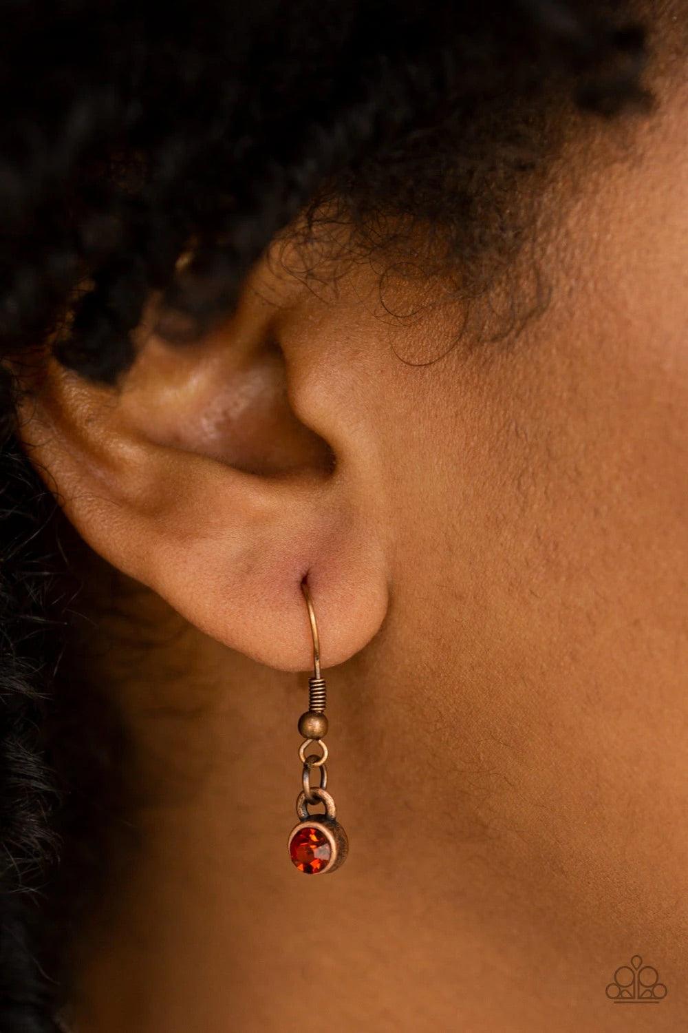 Paparazzi Accessories Court Couture - Copper Radiating with studded copper bars, a glistening marquise shaped frame swings from the bottom of an elongated gunmetal chain. Glittery rhinestones adorn the frame, adding a refined flair to the regal pendant. F