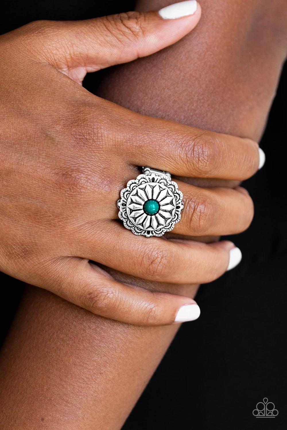 Paparazzi Accessories Daringly Daisy - Green A refreshing green bead is pressed into a glistening silver frame radiating into a floral detail for a seasonal look. Features a stretchy band for a flexible fit. Sold as one individual ring. Jewelry