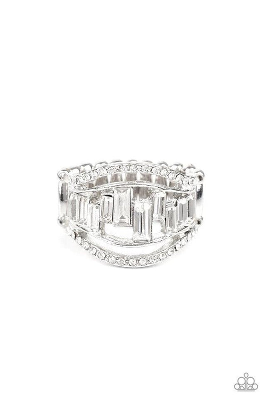 Paparazzi Accessories Treasure Chest Charm - White White rhinestone encrusted bands flank a row of emerald cut glass beads in shades of white for a regal look. Features a stretchy band for a flexible fit. Sold as one individual ring. Jewelry