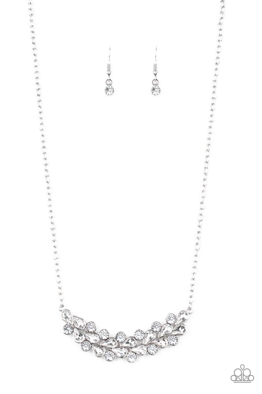 Paparazzi Accessories Special Treatment - White A collection of round and teardrop white rhinestones coalesce into a bowing silver pendant below the collar for a refined look. Features an adjustable clasp closure. Jewelry