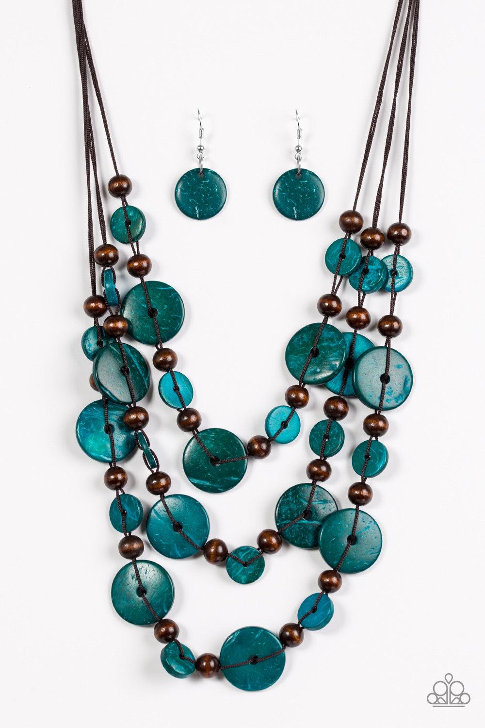 Paparazzi Accessories South Beach Summer - Blue Brushed in a distressed finish, blue and brown wooden beads trickle along three strands, creating a summery look down the chest. Features a button loop closure. Jewelry
