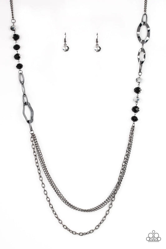 Paparazzi Accessories Modern Girl Glam - Black Dipped in metallic shimmer, a collection of black crystal-like beads and hammered gunmetal frames give way to layers of mismatched gunmetal chains for a modern look. Features an adjustable clasp closure. Sold