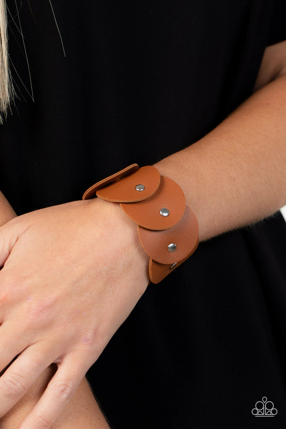 Paparazzi Accessories Rhapsodic Roundup - Brown Overlapping tan leather discs are studded in place around the wrist, resulting in a dizzying rustic centerpiece. Features an adjustable snap closure. Sold as one individual bracelet. Jewelry