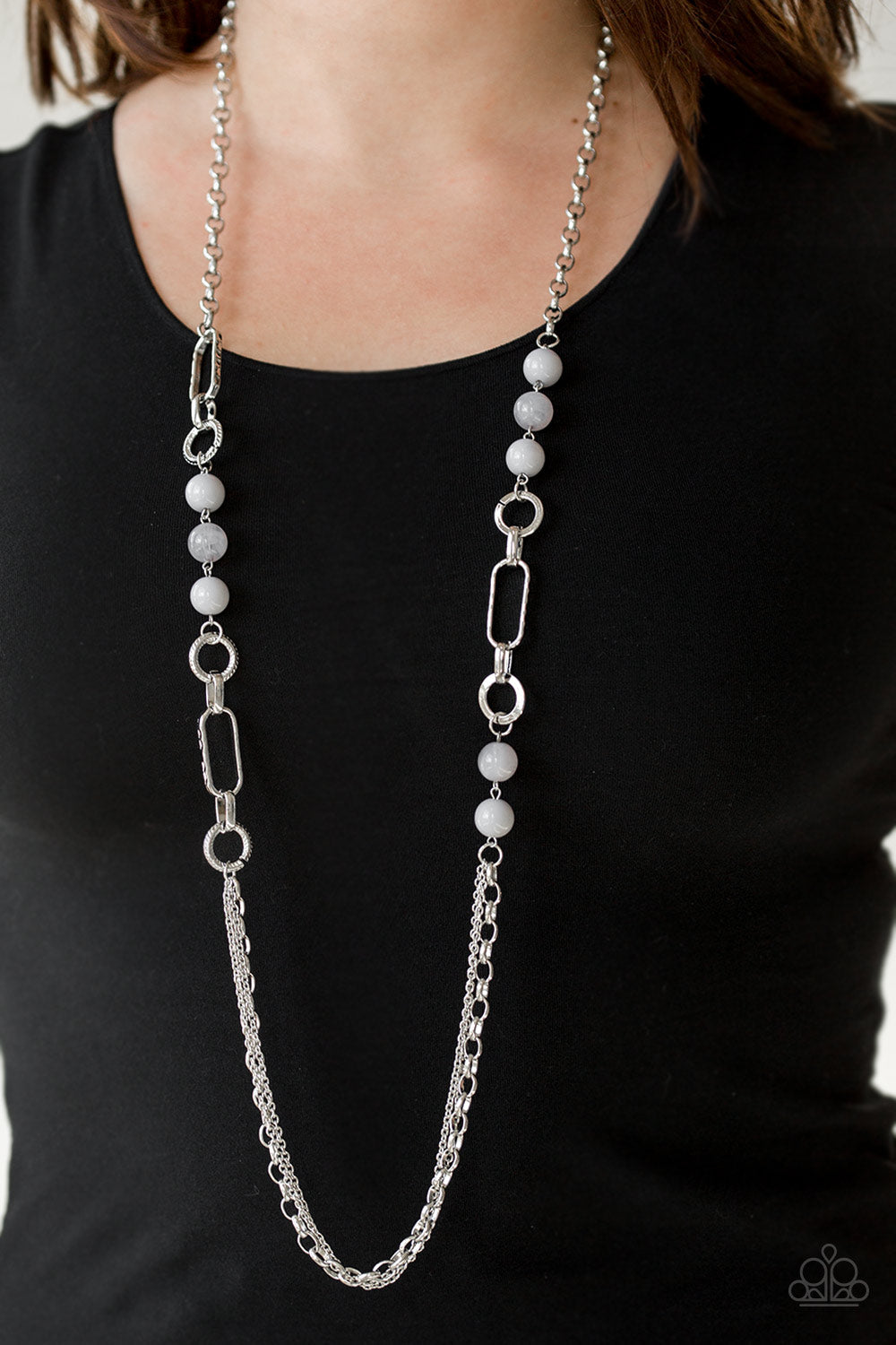 Paparazzi Accessories Cache Me Out - Silver A collection of glassy and polished gray beads give way to layers of mismatched silver chain for a whimsical look. Features an adjustable clasp closure. Sold as one individual necklace. Includes one pair of matc