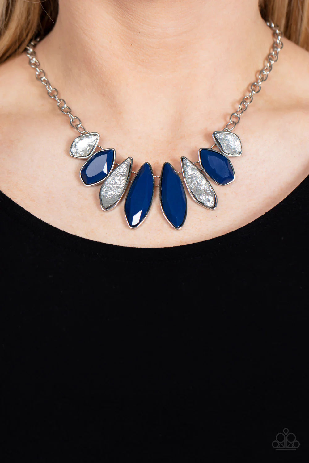 Paparazzi Accessories Crystallized Couture - Blue Alternating between rippling metallic matte wraps that shimmer, and sparkly blue rhinestones, these elongated silver-encased teardrop pendants drape below the collar creating an elegant, edgy staple. Featu