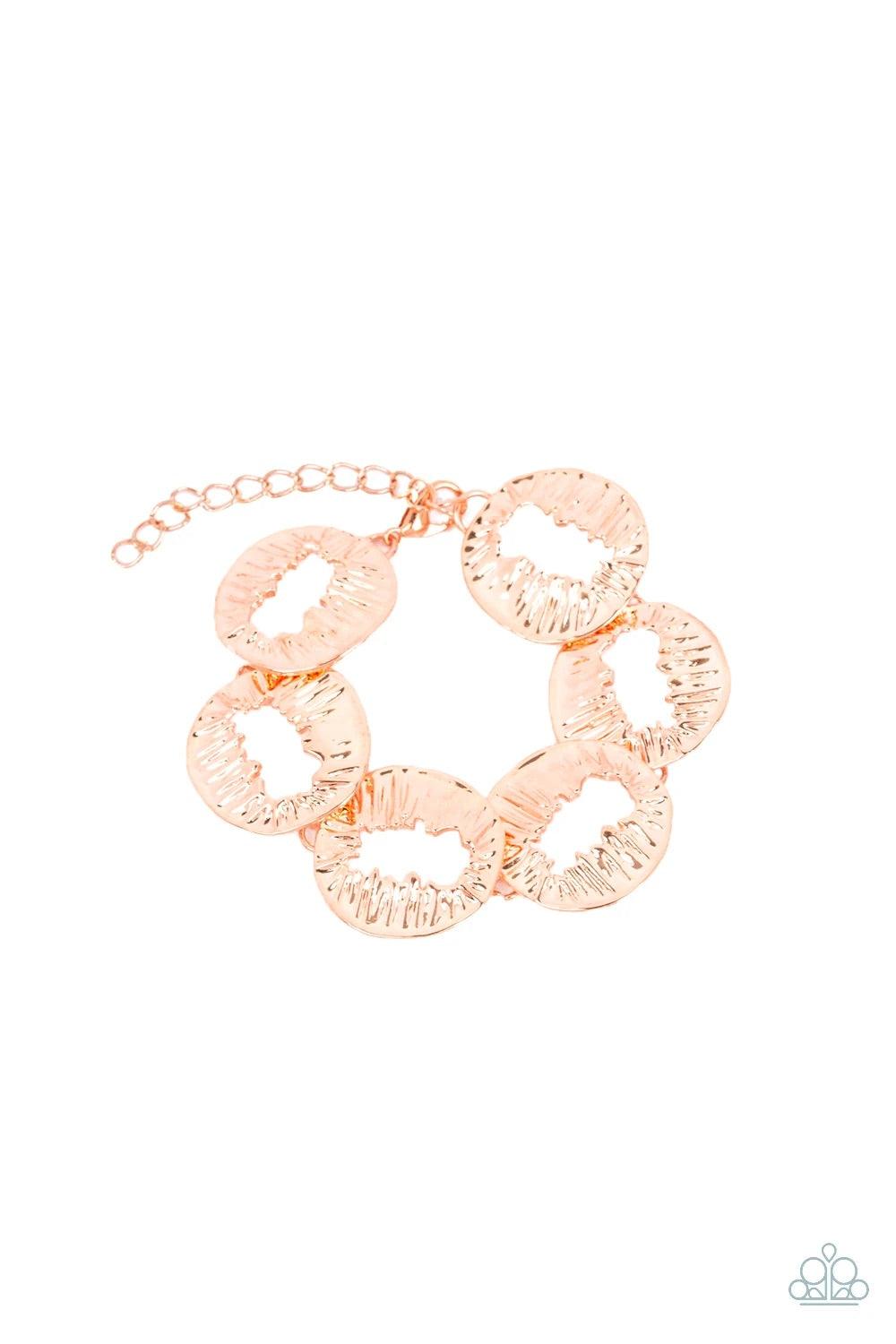 Paparazzi Accessories Cut It Out - Copper Featuring asymmetrical cutout centers, textured shiny copper discs connect across the wrist for an abstract look. Features an adjustable clasp closure. Sold as one individual bracelet. Jewelry
