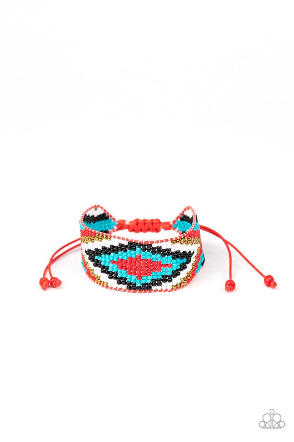 Paparazzi Accessories Beautifully Badlands - Red Threaded along invisible thread, a dainty collection of red, blue, black, brass, and white seed beads weave into a colorful textile pattern across the wrist for a tribal inspired look. Features an adjustabl