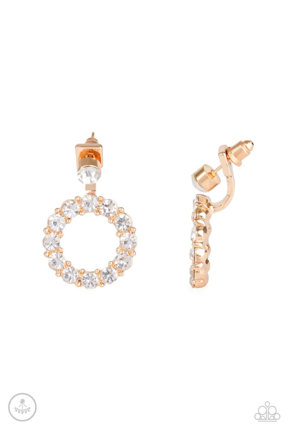 Paparazzi Accessories Diamond Halo - Gold A solitaire white rhinestone attaches to a double-sided post, designed to fasten behind the ear. Encrusted in a ring of glassy white rhinestones, the glittery hoop peeks out beneath the ear for a glamorous look. E