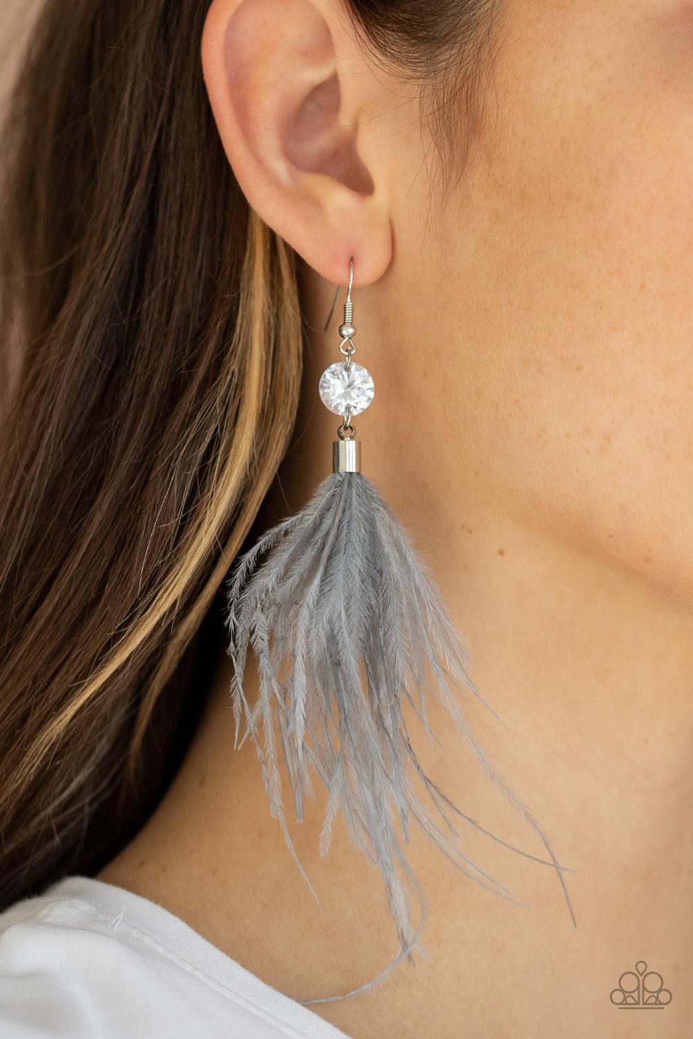 Paparazzi Accessories Feathered Flamboyance - Silver Fuzzy gray feathers swing from the bottom of an oversized white rhinestone, creating a refined lure. Earring attaches to a standard fishhook fitting. Sold as one pair of earrin Jewelry