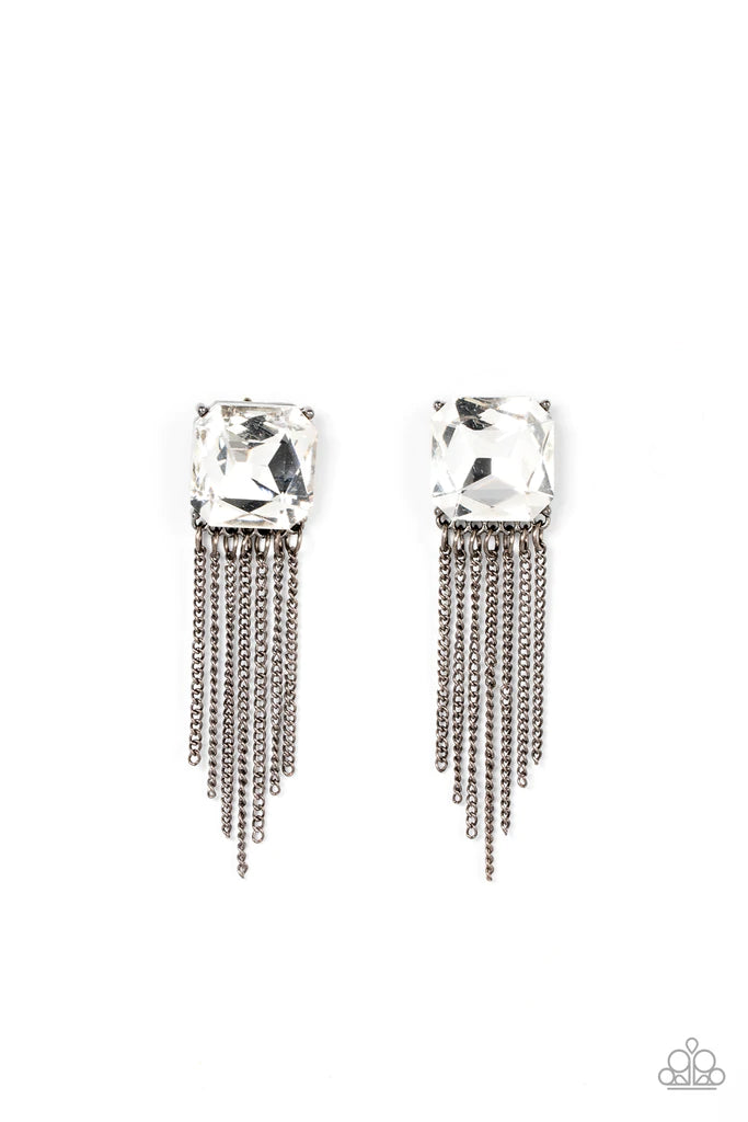 Paparazzi Accessories Supernova Novelty - Black An oversized radiant cut white gem is pressed into a pronged gunmetal fitting that gives way to a tapered curtain of gunmetal chains, resulting in an out-of-this-world sparkle. Earring attaches to a standard