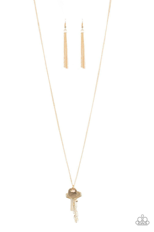 Paparazzi Accessories The Keynoter - Gold A mismatched pair of gold keys swing from the bottom of a shimmery gold chain, creating an edgy pendant. Features an adjustable clasp closure. Jewelry