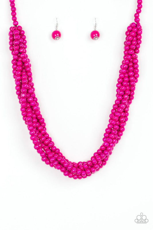 Paparazzi Accessories Tahiti Tropic - Pink Brushed in a flirty pink finish, strands of vivacious wooden beads subtly twist across the chest for a summery look. Jewelry
