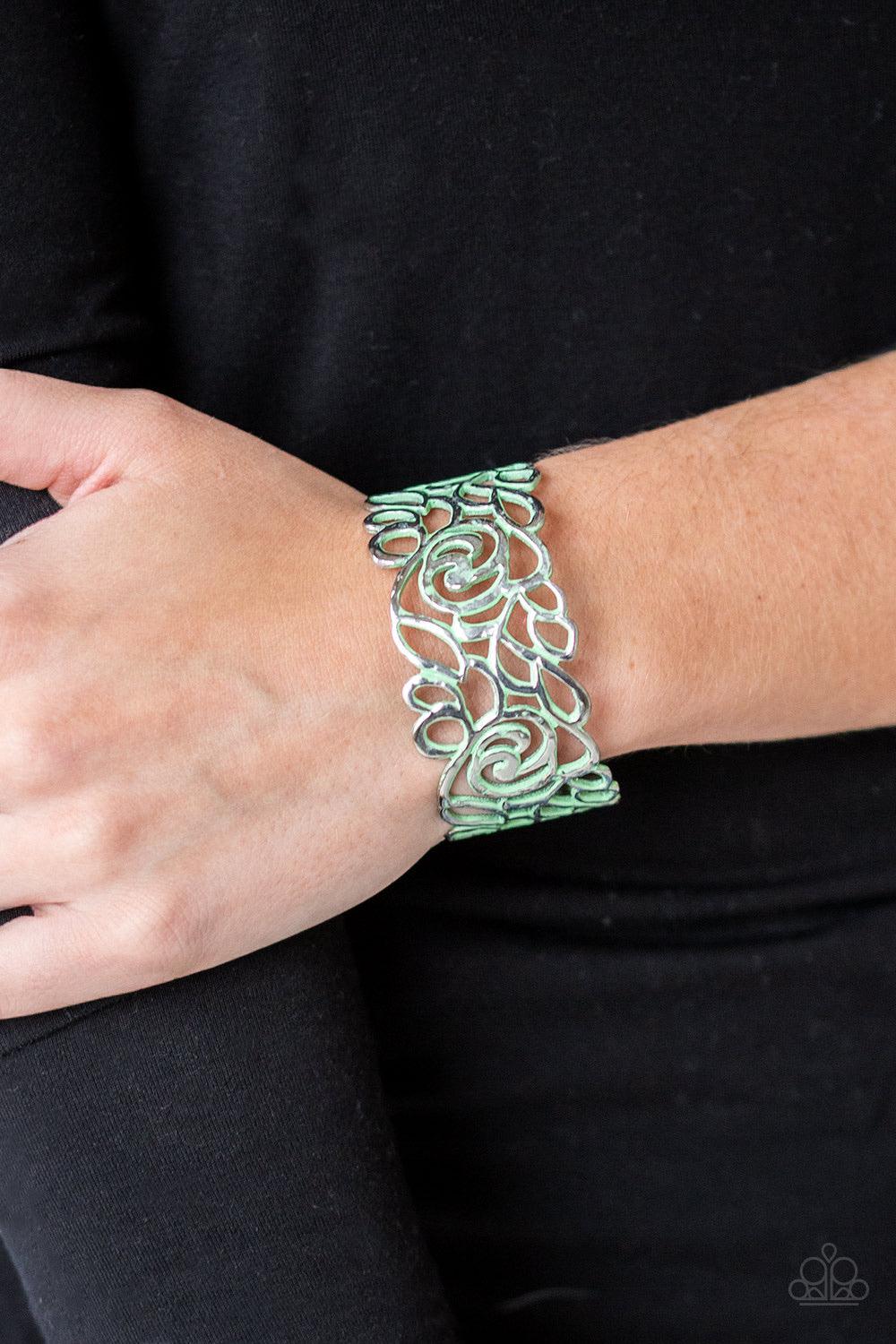 Paparazzi Accessories Victorian Gardens - Green Brushed in a distressed green finish, floral filigree curls across the wrist, coalescing into a colorful cuff. Sold as one individual bracelet. Jewelry