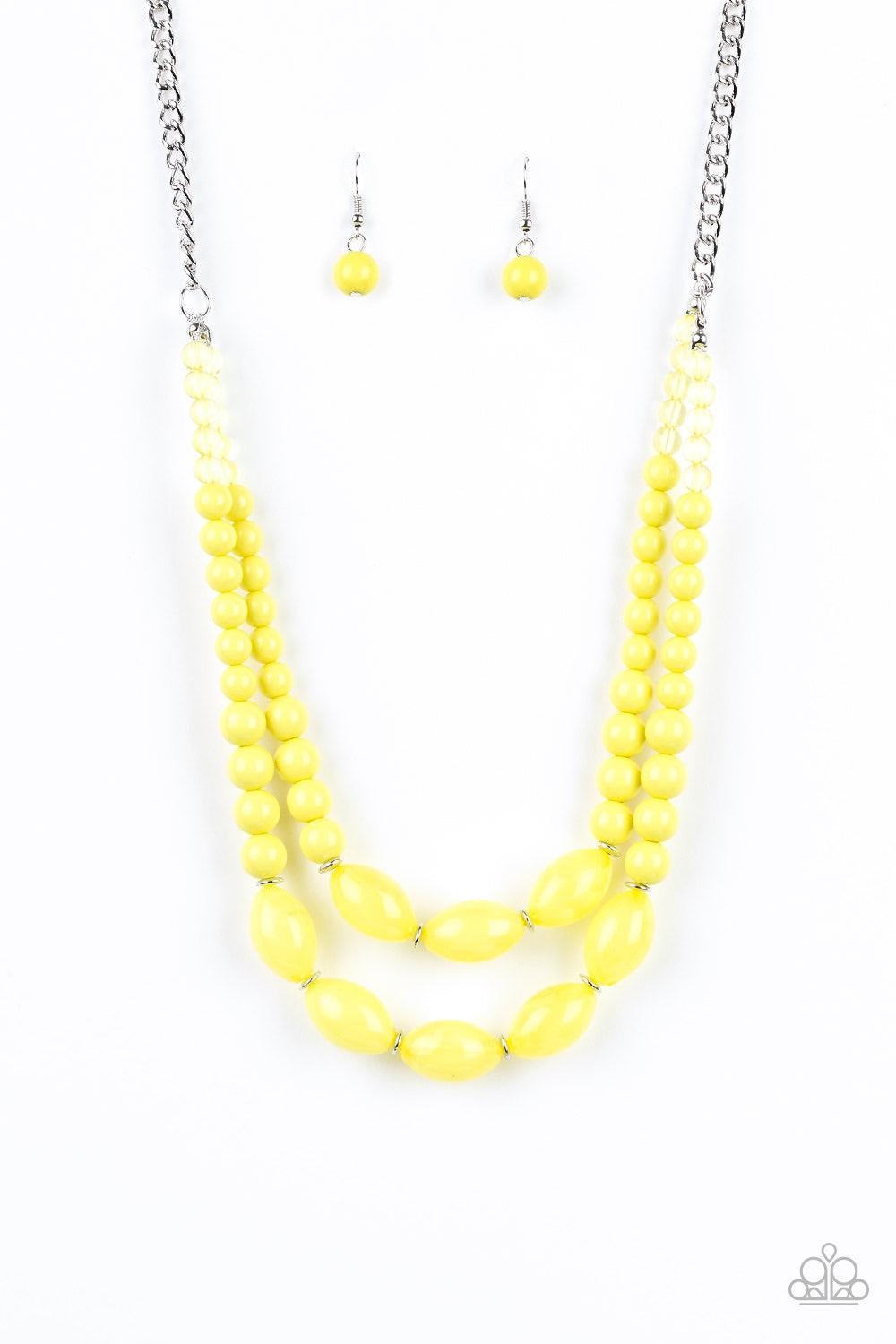 Paparazzi Accessories Sundae Shoppe - Yellow A collection of glassy, polished, and cloudy yellow beads are threaded along two invisible wires below the collar for a beautiful pop of color. Features an adjustable clasp closure. Jewelry