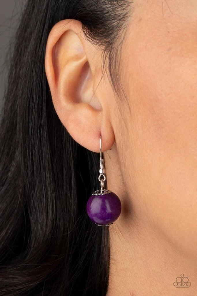 Paparazzi Accessories Cozumel Coast - Purple Featuring round, faceted, and distressed finishes, mismatched brown wooden beads are threaded along shiny brown cording. Vivacious purple wooden beads trickle between the earthy accents, adding a colorful finis