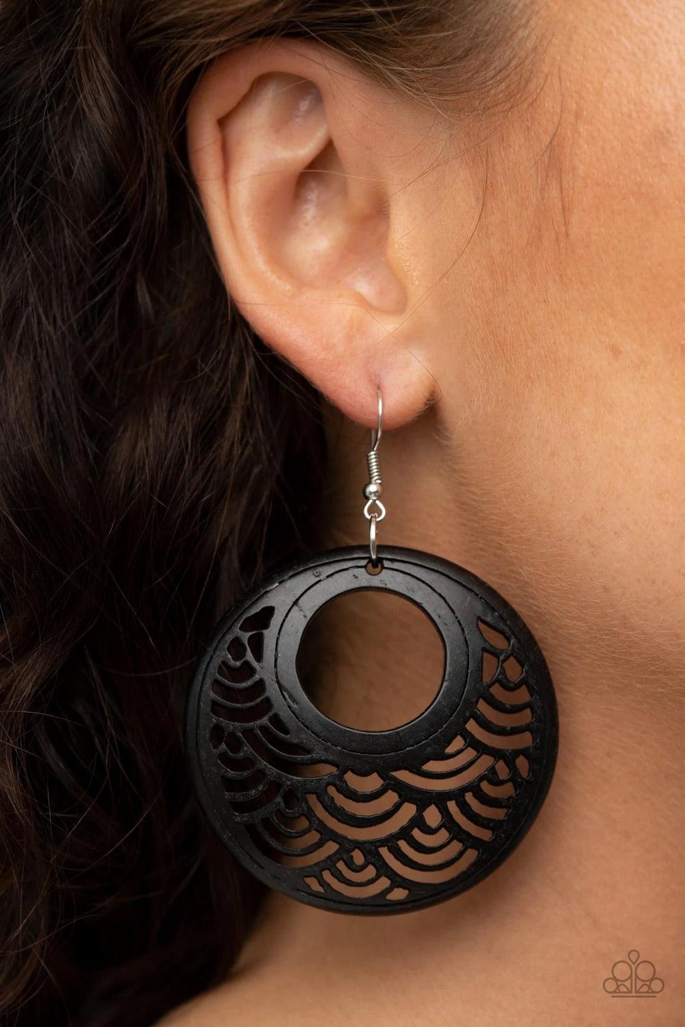 Paparazzi Accessories Tropical Canopy ~Black Brushed in a distressed black finish, a round wooden frame is stenciled into an airy pattern for a seasonal look. Earring attaches to a standard fishhook fitting. Sold as one pair of earrings. Hostess Reward