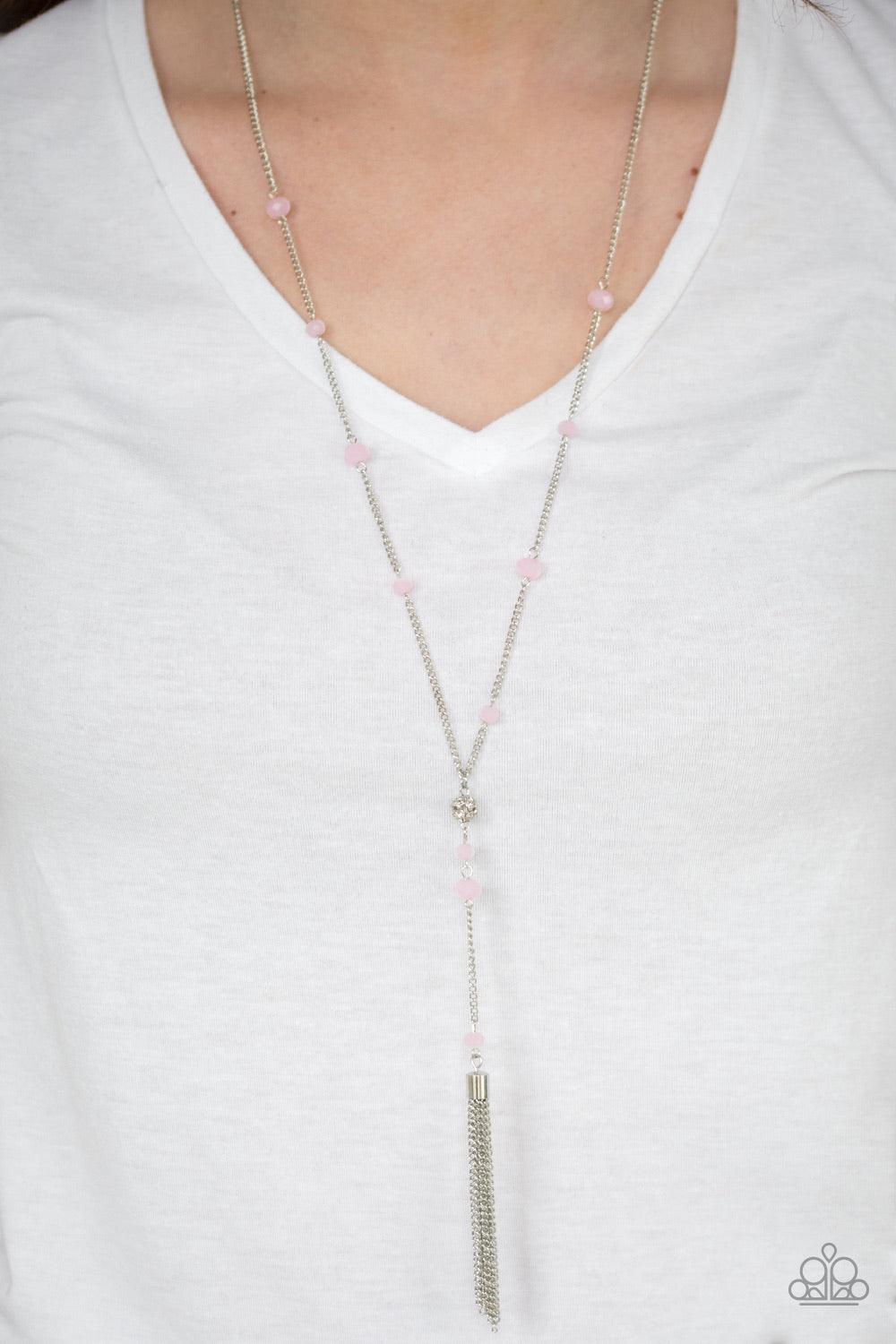 Paparazzi Accessories Out All Night - Pink Pink crystal-like beads trickle down a shimmery silver chain. Encrusted in white rhinestones, a silver bead gives way to a chain extension dotted in matching crystal beads for an elegant finish. Features an adjus