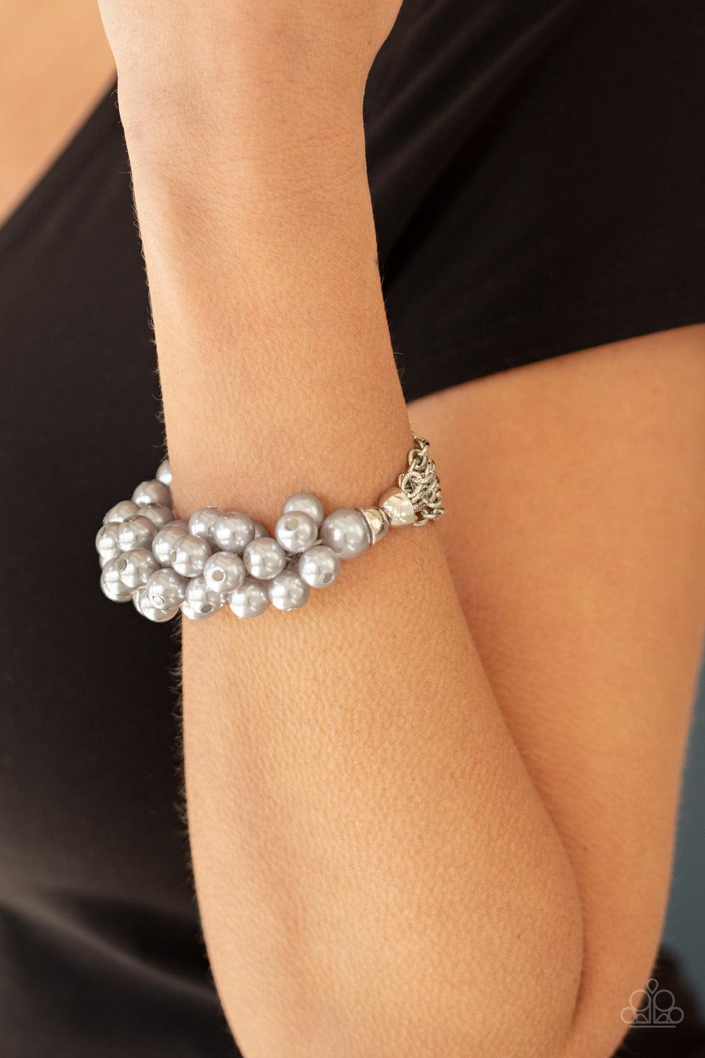 Paparazzi Accessories Up Class Clash - Silver Infused with a stretchy band, sections of shimmery silver chains join clusters of bubbly silver pearls around the wrist, adding a timeless twist to a classic pearl palette. Jewelry