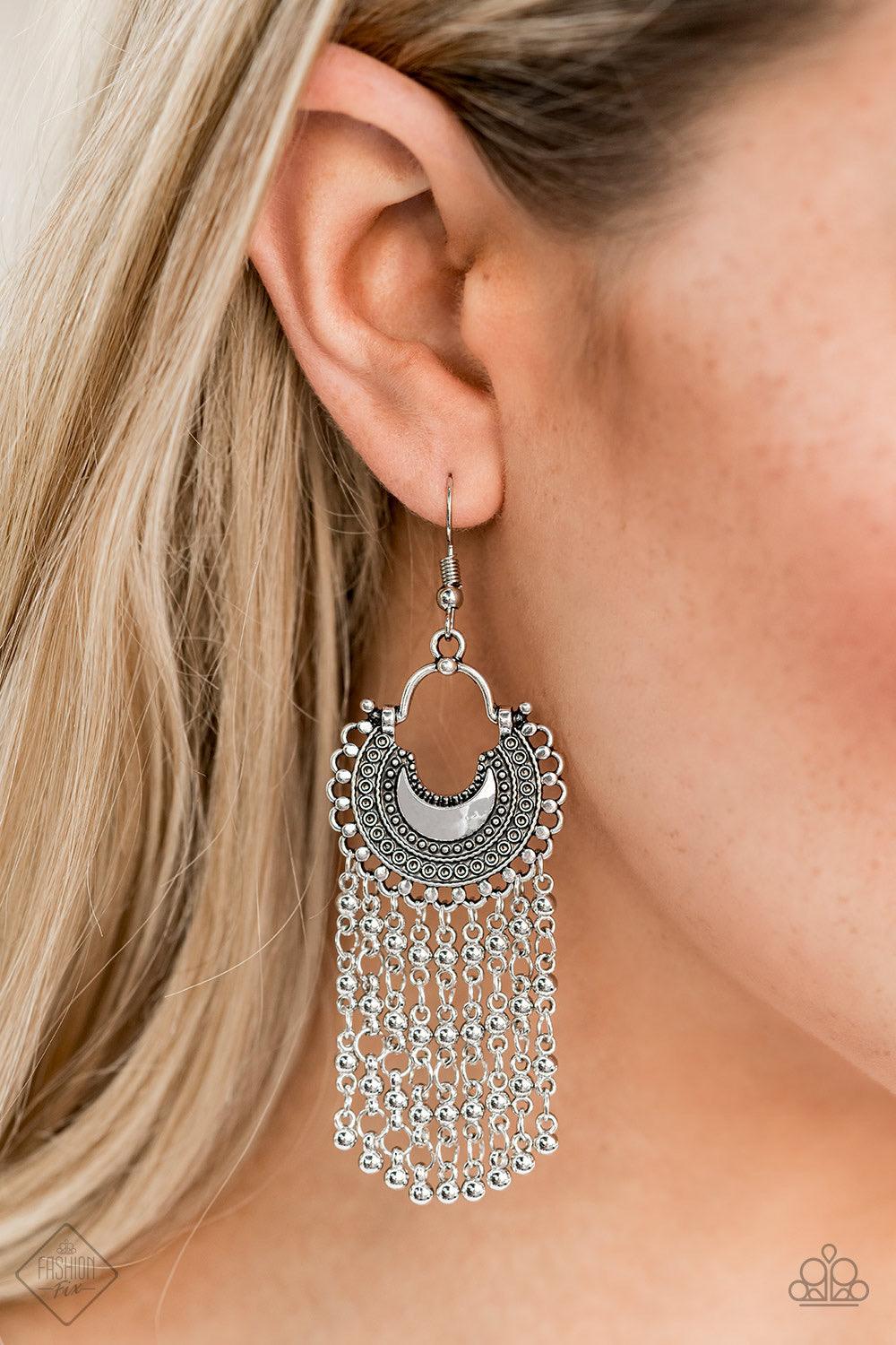 Paparazzi Accessories Catching Dreams - Silver Beaded silver chains stream from the bottom of a textured half-moon silver frame, creating a dreamy fringe. Earring attaches to a standard fishhook fitting. Earrings