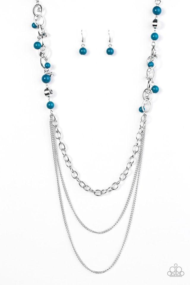 Paparazzi Accessories Carefree and Capricious - Blue Polished blue and faceted silver beads trickle along shimmery silver hoops for an asymmetrical look. The colorful beading gives way to layers of shimmery silver chain for a seasonal finish. Features an