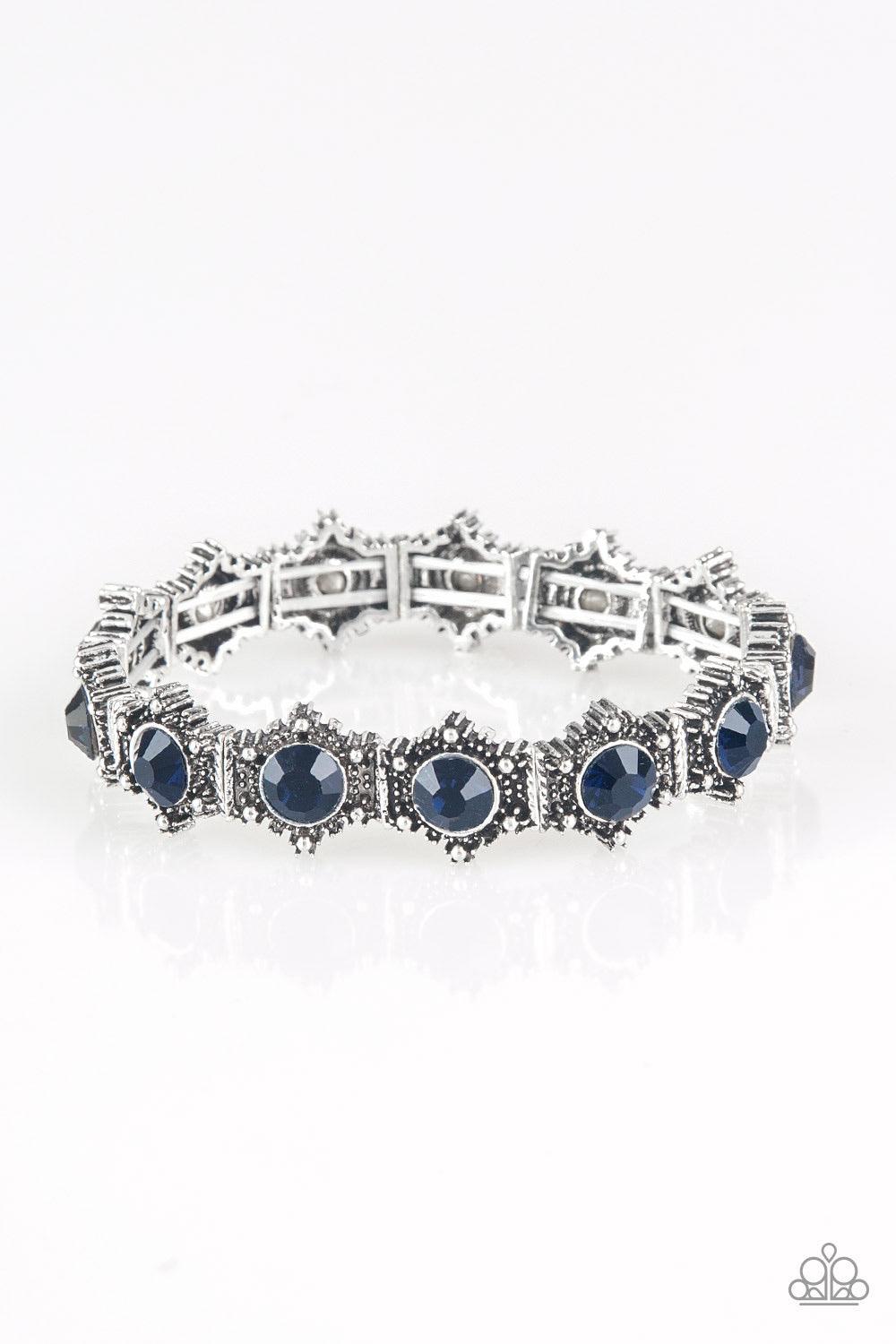 Paparazzi Accessories Strut Your Stuff - Blue Featuring glittery blue rhinestone centers, ornate silver frames are threaded along stretchy bands, linking across the wrist for a refined look. Jewelry