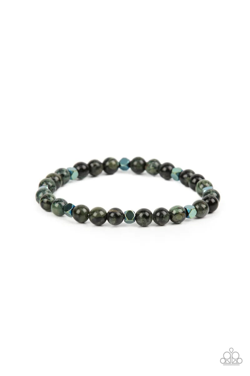 Paparazzi Accessories Interstellar Solitude - Green A dainty collection of speckled green stone beads and faceted metallic cube beads are threaded along a stretchy band around the wrist for an earthy flair. Sold as one individual bracelet. Jewelry