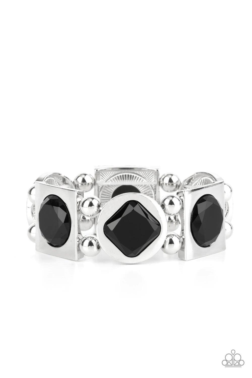 Paparazzi Accessories Asymmetrical A-Lister - Black Infused with pairs of silver beads, a faceted collection of round and square black gems are pressed into matching silver frames as they glide along stretchy bands around the wrist for a refined fashion.