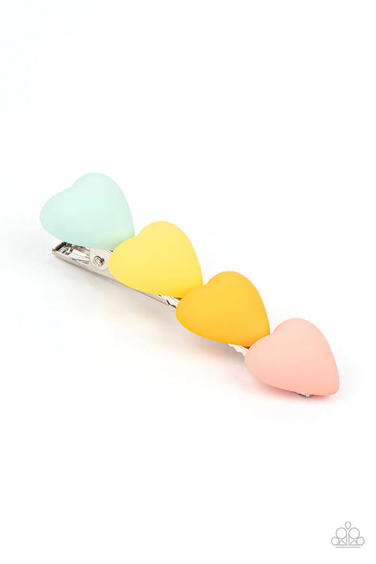 Paparazzi Accessories HEART to Please - Multi Featuring a rubbery matte finish, a bubbly row of green, yellow, orange, and coral hearts stack into a flirtatious centerpiece. Features a standard hair clip on the back. Sold as one individual hair clip. Hair