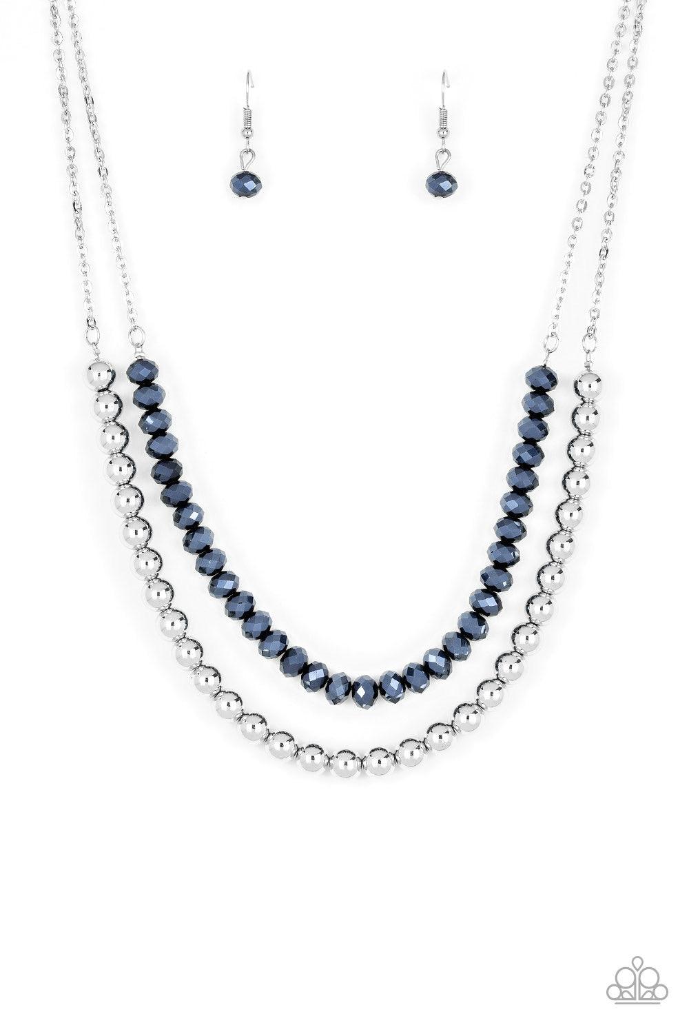 Paparazzi Accessories Color of the Day - Blue Dipped in a metallic shimmer, a strand of glittery blue crystal-like beads gives way to a strand of shiny silver beads below the collar for a colorfully layered look. Features an adjustable clasp closure. Jewe