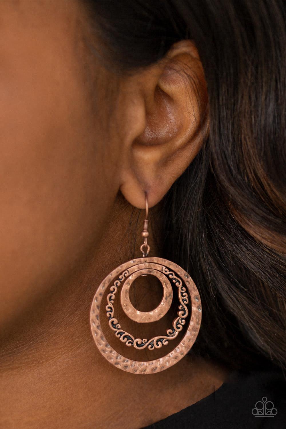 Paparazzi Accessories Out Of Control Shimmer - Copper A collection of hammered and filigree filled copper hoops ripple from the ear, coalescing into a dizzying frame. Earring attaches to a standard fishhook fitting. Jewelry