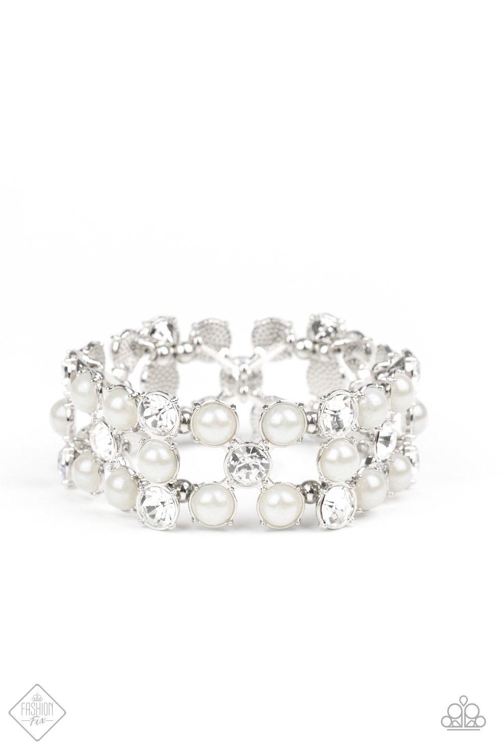 Paparazzi Accessories Diamonds and Debutantes - White Classic white pearls and brilliant white rhinestones are nestled into sleek silver frames and threaded along a stretchy band that wraps glamorously around the wrist. Jewelry