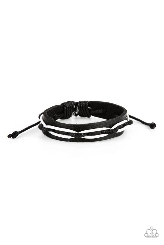 Paparazzi Accessories Lucky Locomotion - Black Black and white cording is interwoven across the top of a black leather band creating an edgy crisscrossed motion as it travels around the wrist. Features an adjustable sliding knot closure. Sold as one indiv