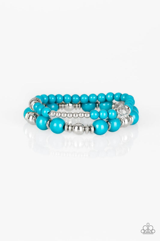 Paparazzi Accessories Colorful Collisions - Blue A collection of polished blue, shiny silver, and faceted crystal-like beads are threaded along stretchy bands around the wrist for a colorfully layered look. Sold as one set of two bracelets. Jewelry