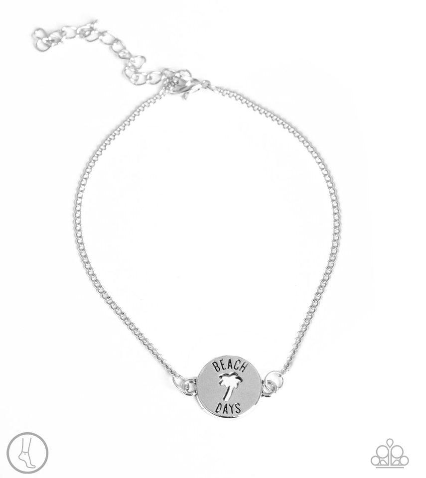 Paparazzi Accessories Summer Shade - Silver *Anklet Featuring an airy palm tree cutout and the words, "Beach Days", a shimmery silver charm attaches to a dainty silver chain around the ankle for a summery look. Features an adjustable clasp closure. Jewelr
