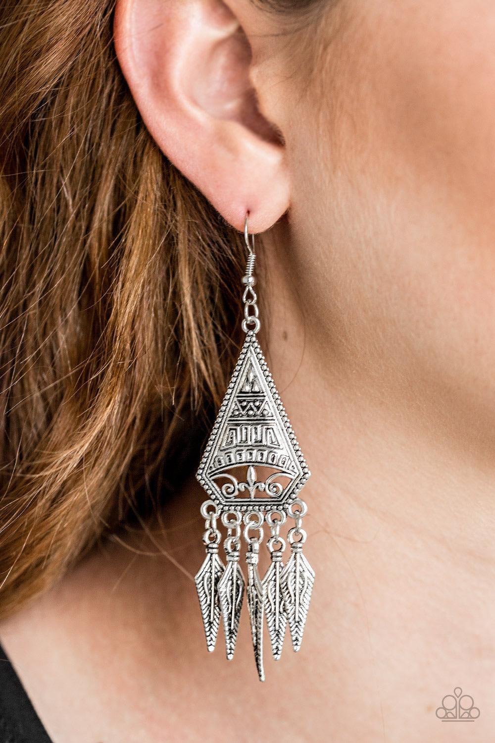 Paparazzi Accessories Me Oh MAYAN - Silver Embossed in tribal inspired patterns, a triangular frame gives way to shimmery silver feather-like frames, creating a free-spirited fringe. Earring attaches to a standard fishhook fitting. Jewelry