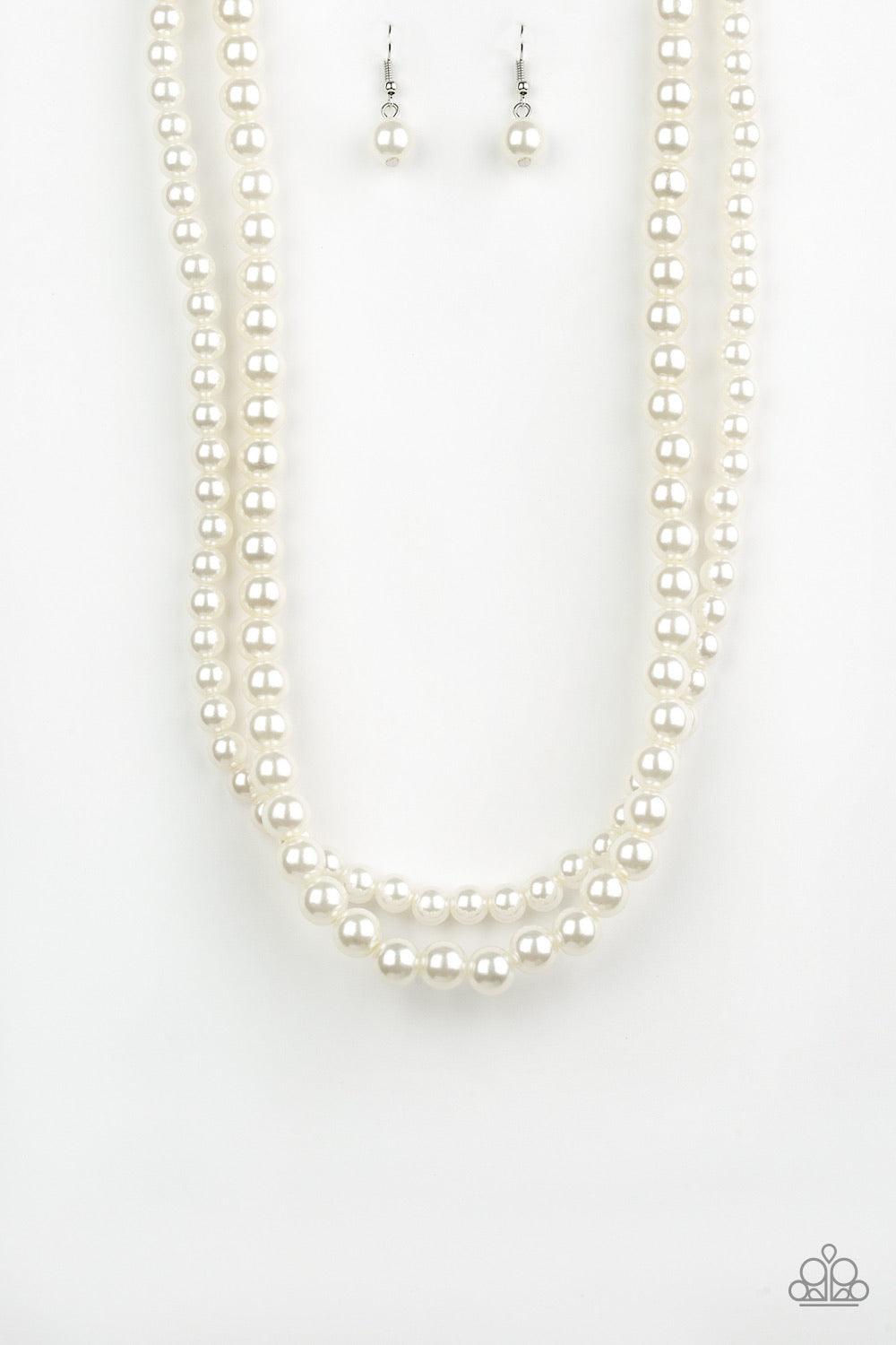 Paparazzi Accessories Woman of the Century ~White Two strands of classic white pearls are strung along invisible wires below the collar. Each strand slightly varies in size, adding a modern twist to the timeless pearl palette. Features an adjustable clasp