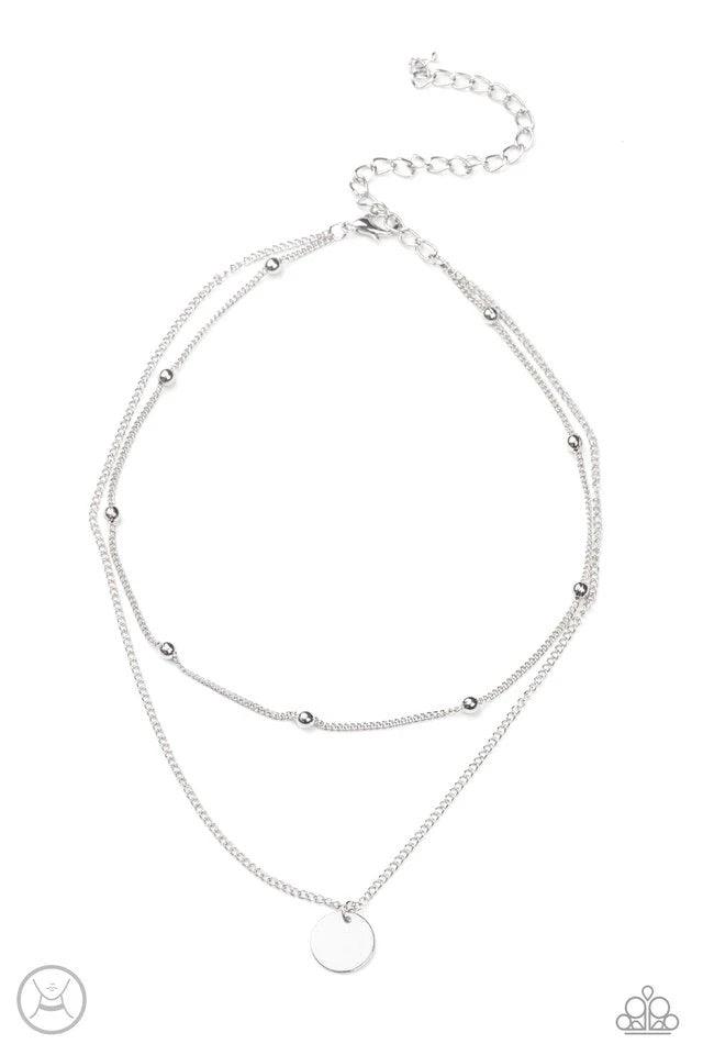 Paparazzi Accessories Modestly Minimalist - Silver Infused with a silver beaded chain, a dainty silver disc slides along a classic silver chain around the neck, creating sleek layers. Features an adjustable clasp closure. Sold as one individual choker nec